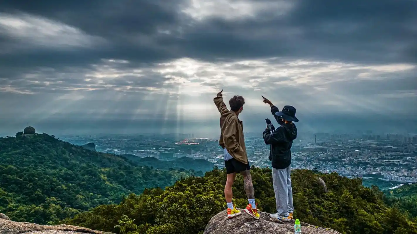 standing on the mountain
